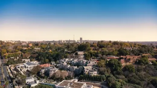 Aerial view of a leafy Gauteng suburb at dusk